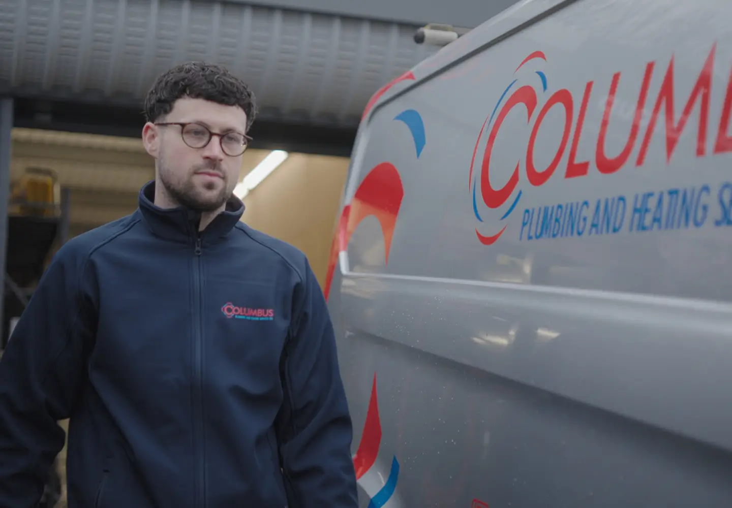 columbus_heating_man_next_to_branded_van