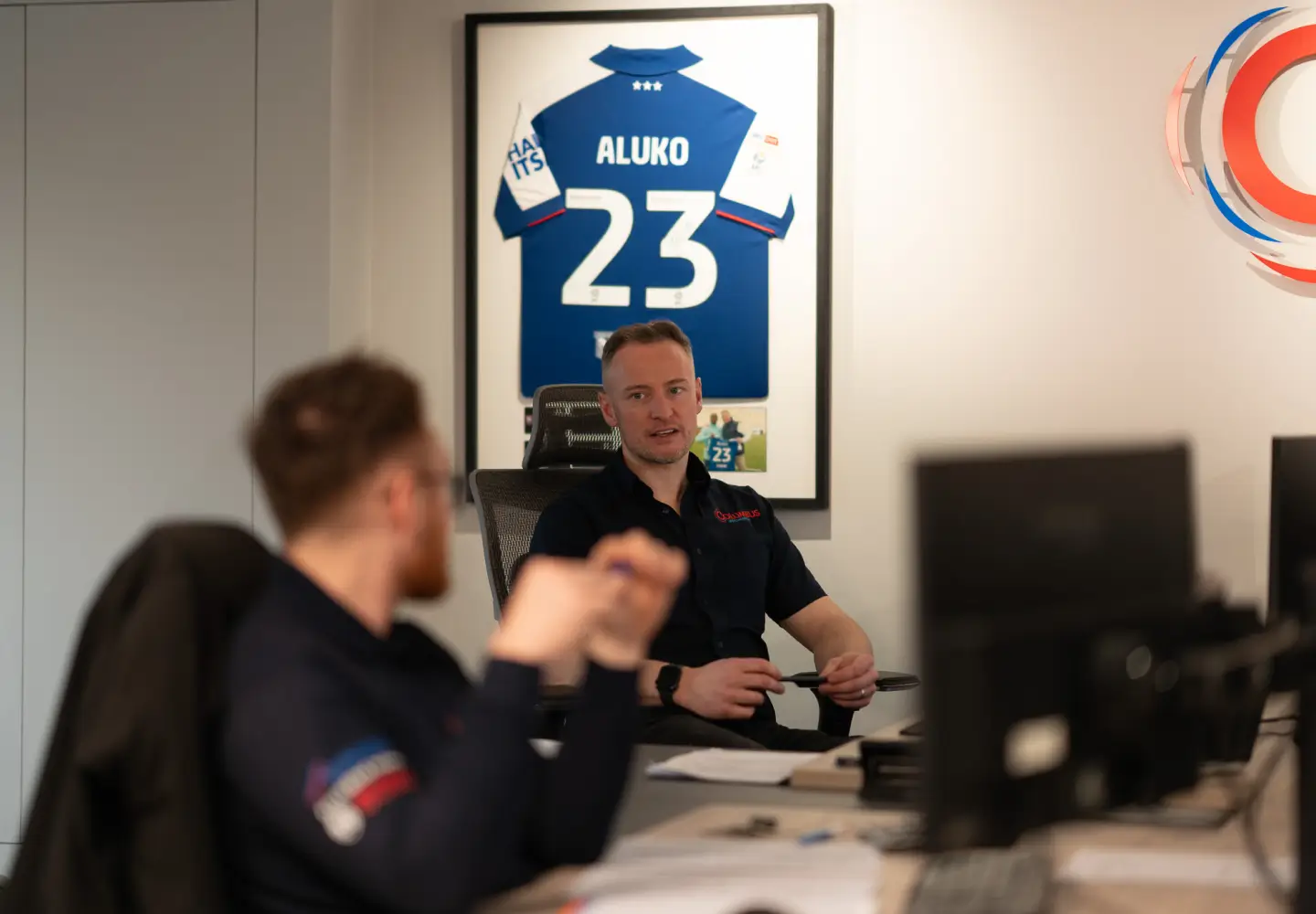 columbus_heating_office_shot_of_two_workers_talking The Columbus team